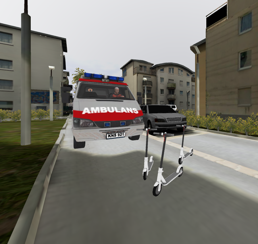 Ambulans, który nie może przejechać przez drogę wewnętrzną na osiedlu, ponieważ zastawiają ją porzucone hulajnogi.